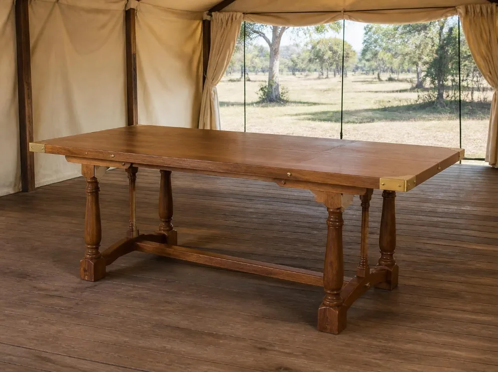 Jaisalmer trestle dining table in solid teak with brass fittings