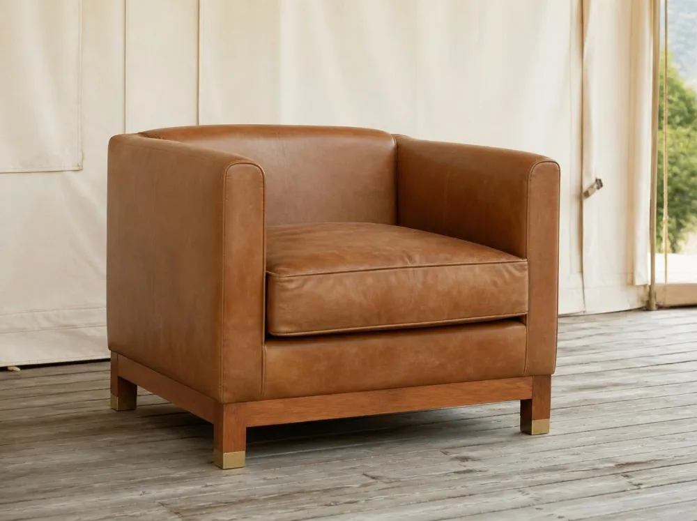 Kumbhalgarh leather club chair in solid teak with brass fittings
