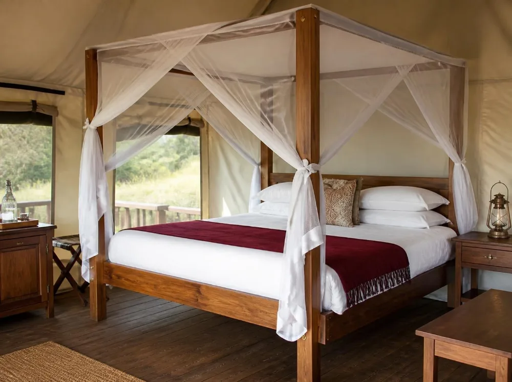 Shivalik safari four-poster in solid teak with brass fittings