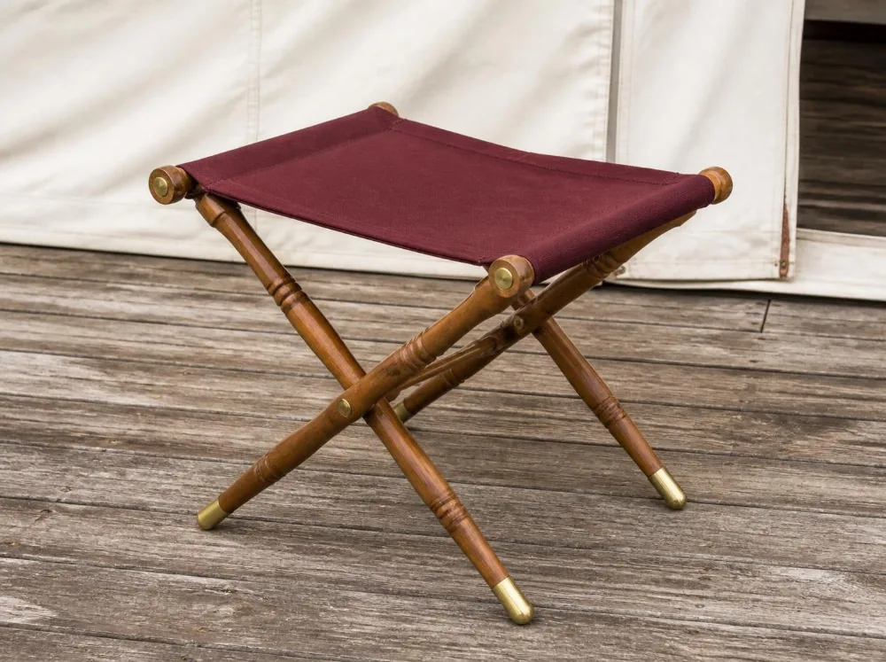 Thar folding stool in solid teak with brass fittings